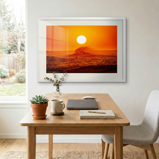 Framed artwork of a sunset over the ocean with a surfer and wave. Northern Beaches Sydney Long Reef