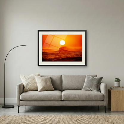 Framed artwork of a sunset over the ocean with a surfer and wave. Northern Beaches Sydney Long Reef