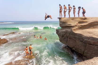 Australia Day beach jumpers diving into ocean Australian summer coastal scene